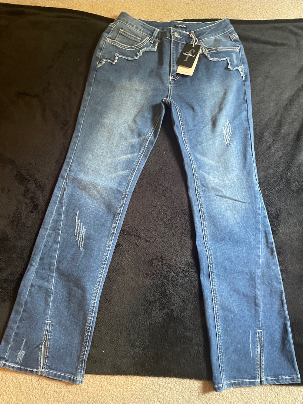 Flared Distressed Blue Jeans with Subtle Slit - Women's